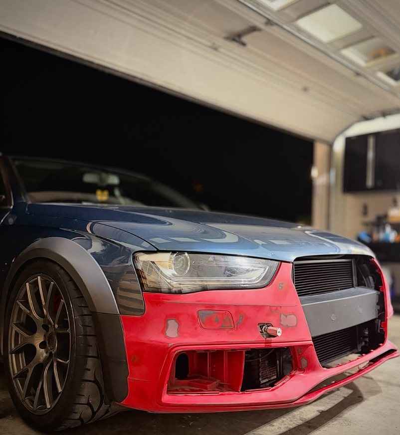 Front three-quarter view in the garage showing the fender against the S4 bumper